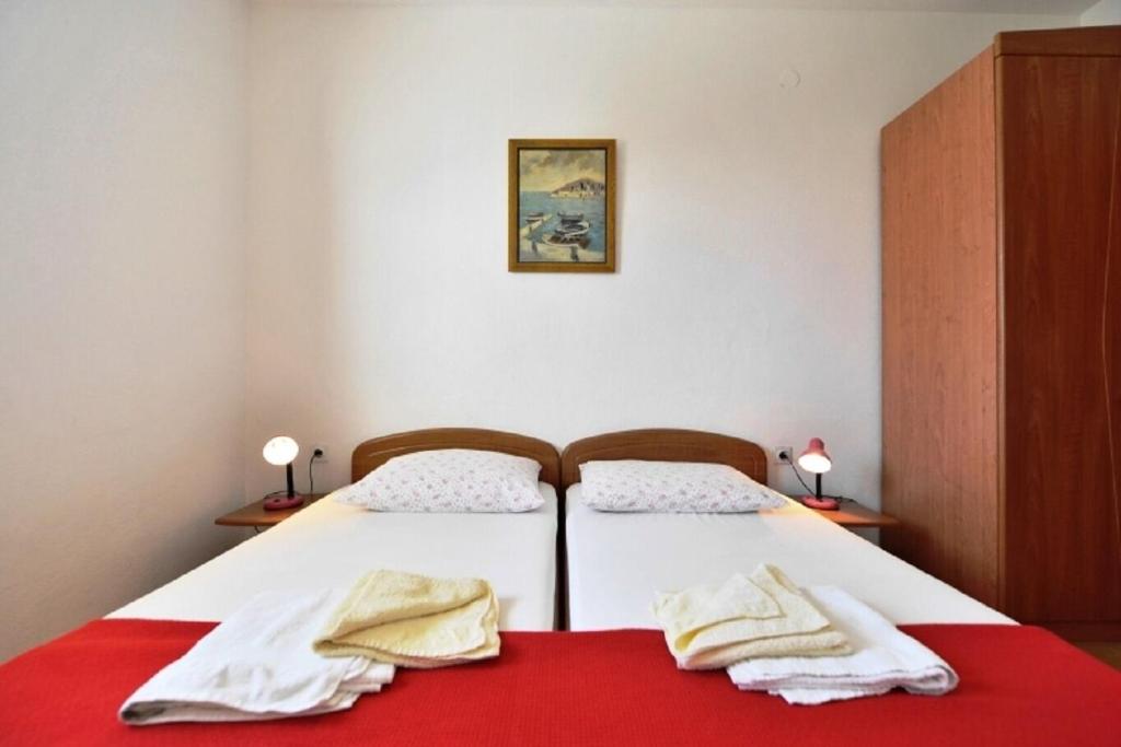 Postel nebo postele na pokoji v ubytování Apartments Nikola