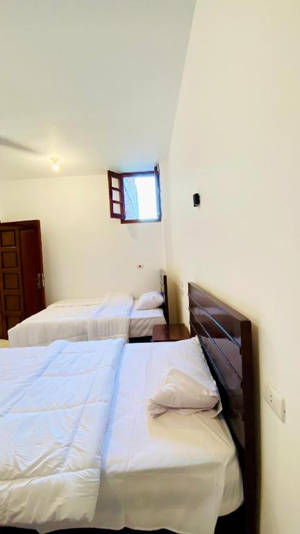 Postel nebo postele na pokoji v ubytování villa Sun Wing - Guest House