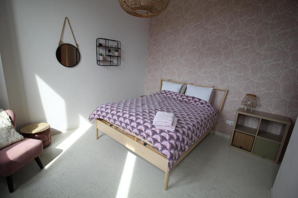 Postel nebo postele na pokoji v ubytování Gîte Le Salmon