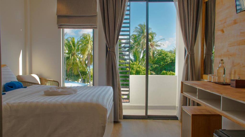 Postel nebo postele na pokoji v ubytování Atoll Retreat