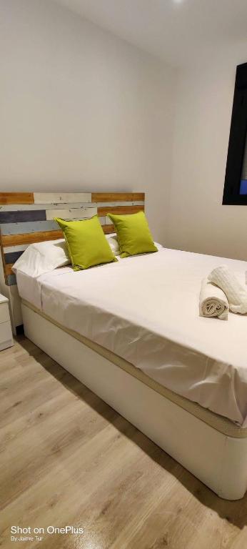 A bed or beds in a room at Ático con Piscina y Vistas al Mar Habitat Litoral