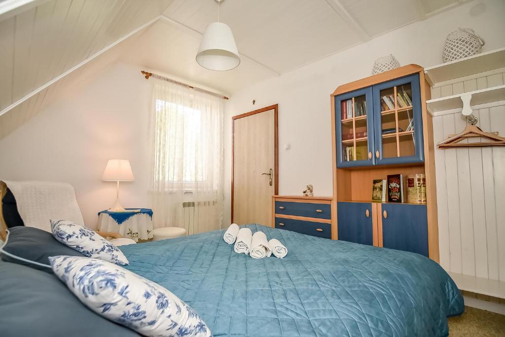Posteľ alebo postele v izbe v ubytovaní Apartament w Alejce