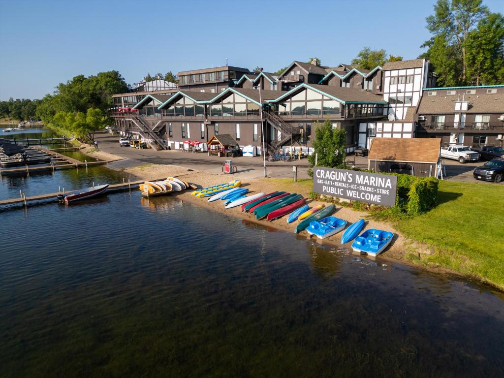 a bunch of boats are lined up in the water at Cragun's Resort on Gull Lake in Brainerd