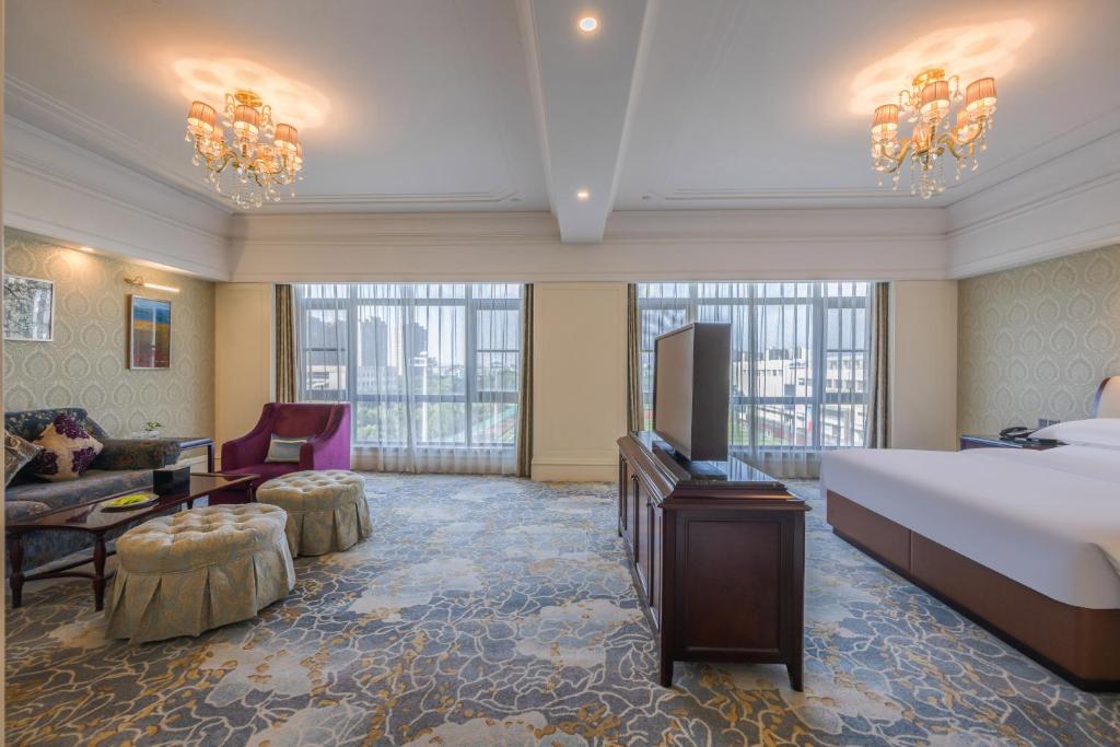 Postel nebo postele na pokoji v ubytování 康桥小镇酒店