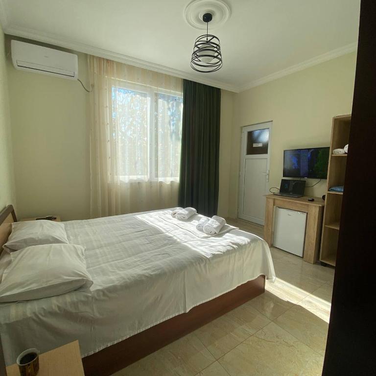 Postel nebo postele na pokoji v ubytování Guest House Deme