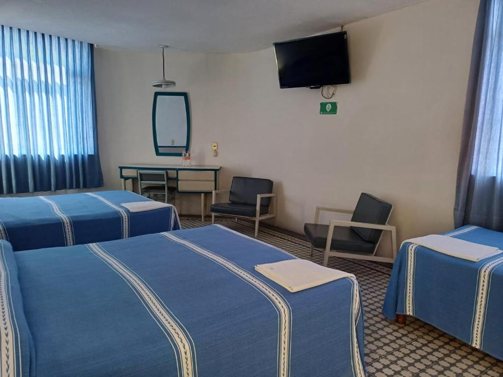 Postel nebo postele na pokoji v ubytování HOTEL OLIDEN