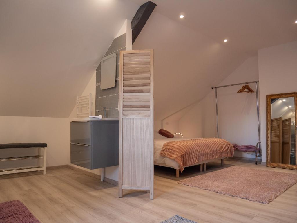 Postel nebo postele na pokoji v ubytování La Suite