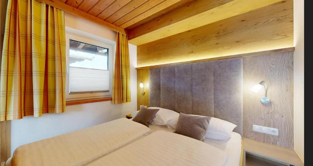 Postel nebo postele na pokoji v ubytování Landhaus Foidl