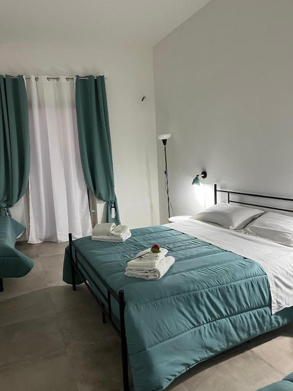 Postel nebo postele na pokoji v ubytování Falaride suite Agrigento discesa sulla valle di oro
