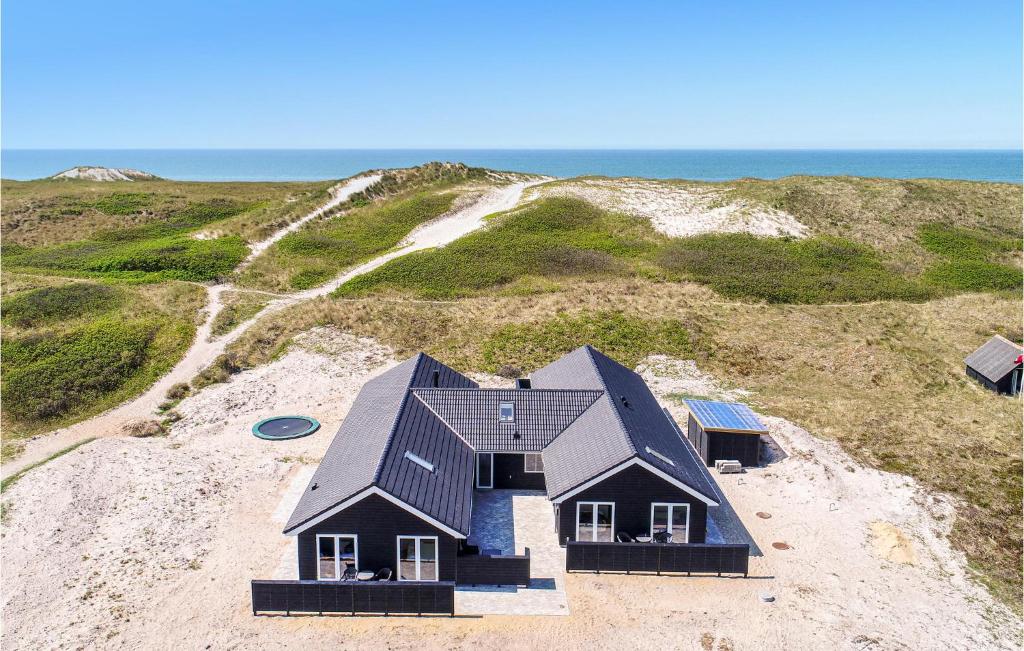 an aerial view of a house on a beach at Cozy Home In Hvide Sande With Wifi in Bjerregård
