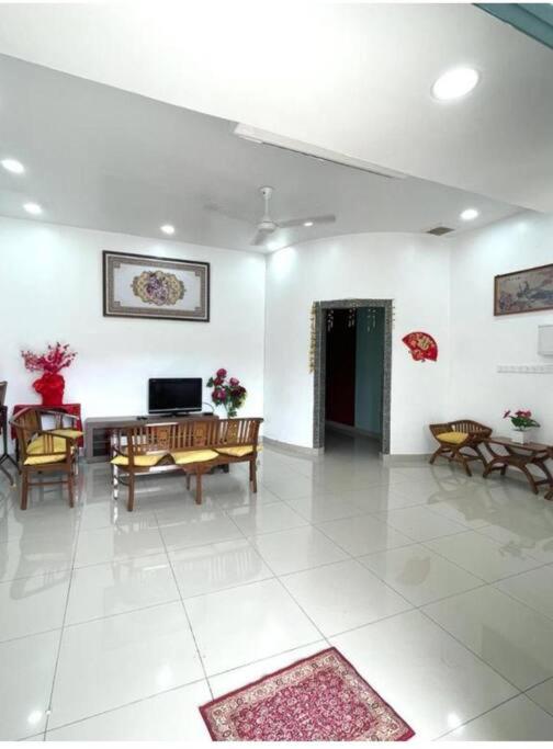 a large living room with a table and chairs at RALI PD HOME D 16Pax karaoke and swimming pool in Port Dickson