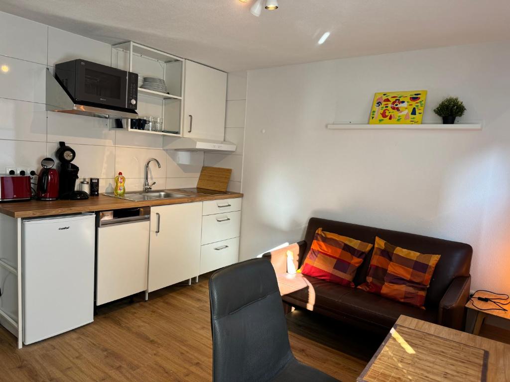 Kuchyň nebo kuchyňský kout v ubytování 2 Zimmer Apartment mit kostenlosem Parkplatz