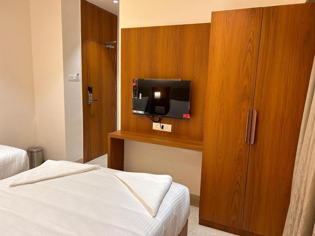 Postel nebo postele na pokoji v ubytování Hotel Neem Heritage