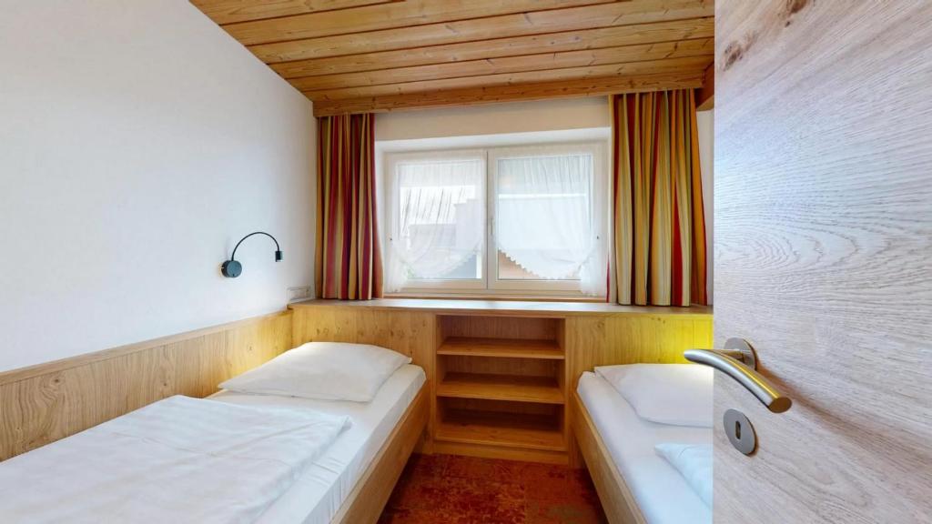 Postel nebo postele na pokoji v ubytování Landhaus Foidl