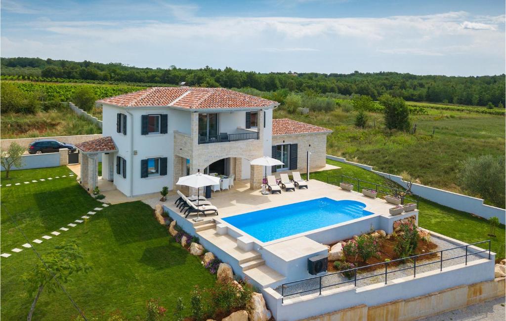 an aerial view of a house with a swimming pool at Villa Marika in Lašći