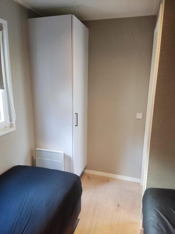 Postel nebo postele na pokoji v ubytování Natuurchalet Hellendoorn met Hottube!