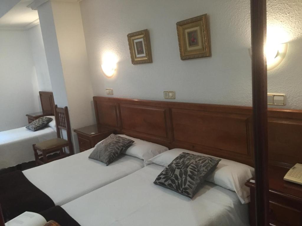 Postel nebo postele na pokoji v ubytování Hotel Martin