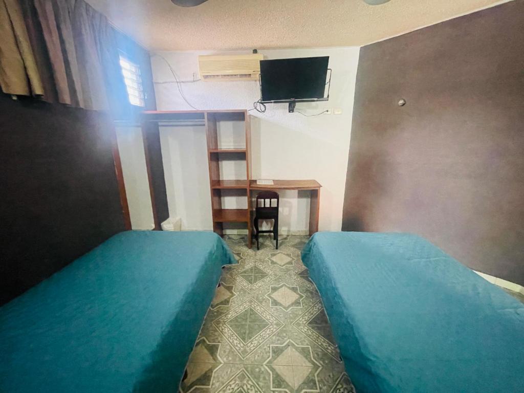 TV a/nebo společenská místnost v ubytování Hotel Lol Tun