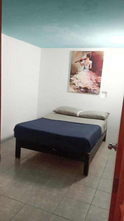Postel nebo postele na pokoji v ubytování Hotel RJ Querétaro