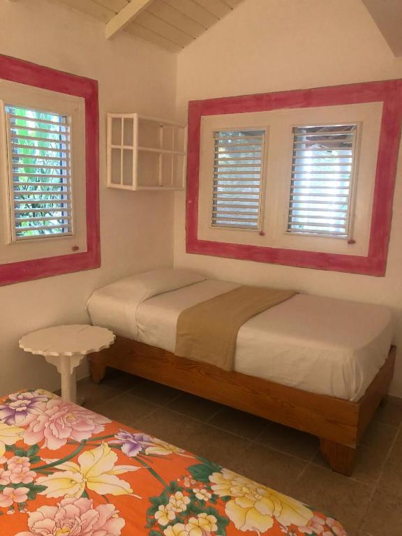 Postel nebo postele na pokoji v ubytování Hotel Casa Robinson