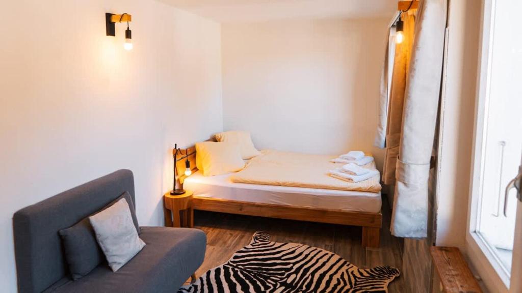 Postel nebo postele na pokoji v ubytování Apartment Olsa - Cozy Studio in Kandersteg