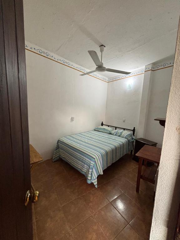 Postel nebo postele na pokoji v ubytování Hotel Posada Playa Manzanillo