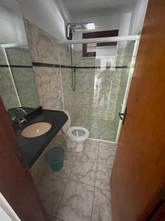 a bathroom with a shower and a sink and a toilet at Pindoretama sitio in Pindoretama