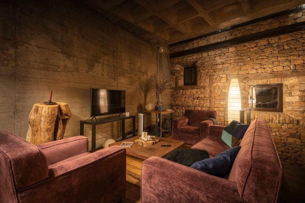 Televízia a/alebo spoločenská miestnosť v ubytovaní Loft Rural LaCalata