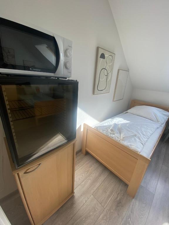 Postel nebo postele na pokoji v ubytování Pension Lizzi