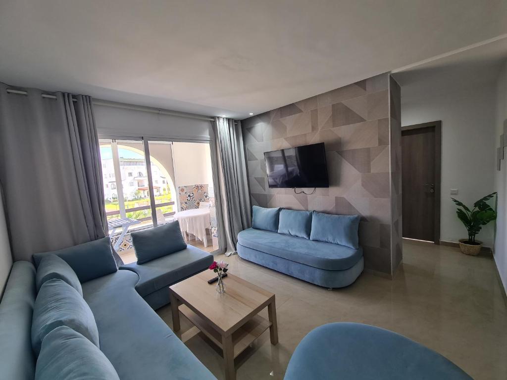 Posezení v ubytování Charmant appartement en résidence piscine