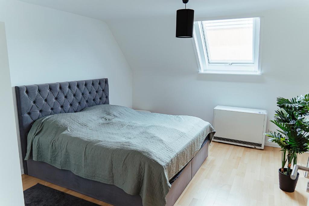 Postel nebo postele na pokoji v ubytování Proud-Apartments Gießen