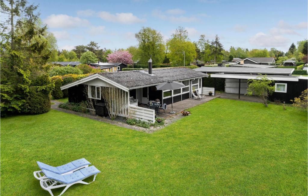 an aerial view of a house with a yard at Cozy Home In Idestrup With Wifi in Marielyst