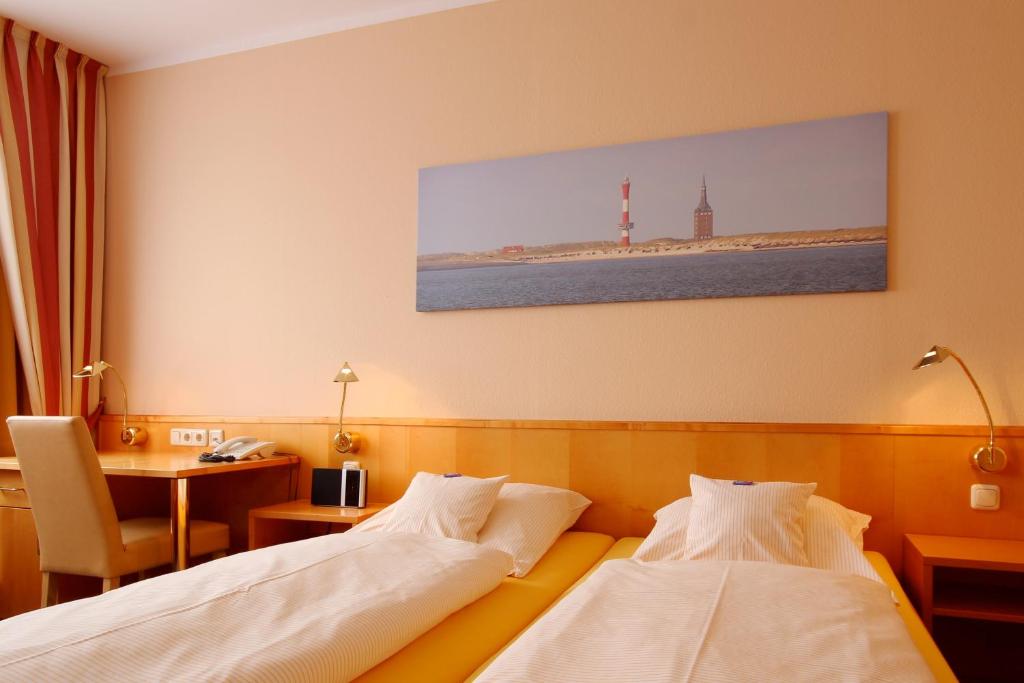 Postel nebo postele na pokoji v ubytování Hotel Hanken GmbH, Hotel Hanken und Seehotel