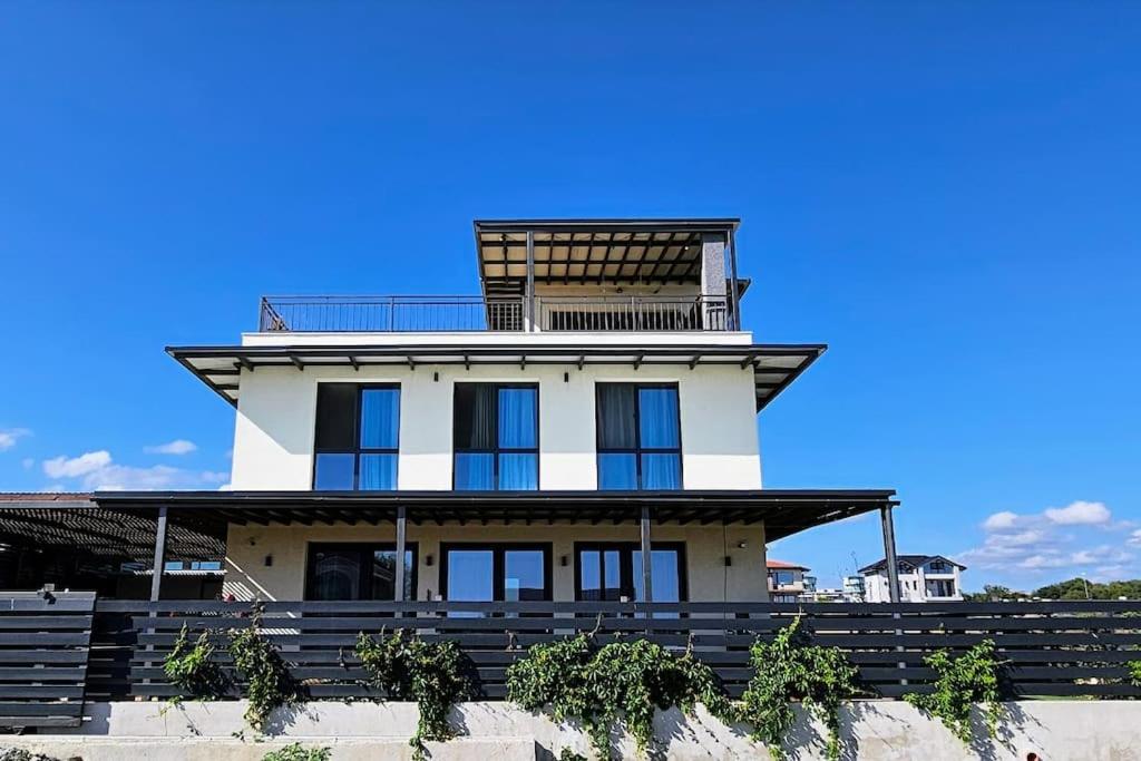 a house with a tower on top of it at 3-Bedroom Villa in Lozenets, Burgas, Bulgaria in Lozenets