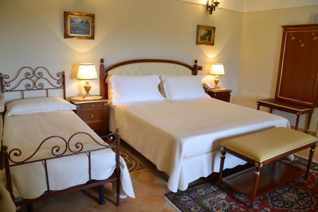 Postel nebo postele na pokoji v ubytování Sangiorgio Resort & Spa