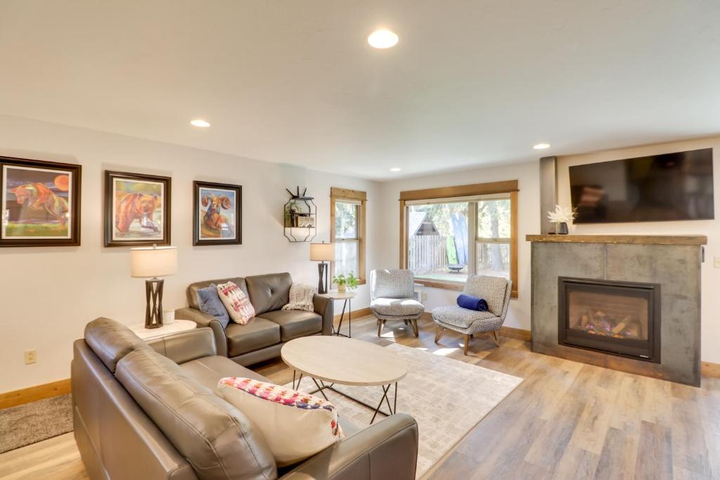 a living room with a couch and a fireplace at 5 Mi to Whitefish Resort Minutes to Chairlifts! in Whitefish