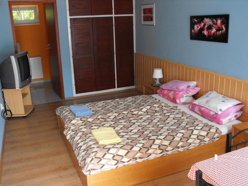 Postel nebo postele na pokoji v ubytování Siesta Üdülő