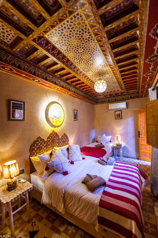 Postel nebo postele na pokoji v ubytování Riad Almonds Marrakech