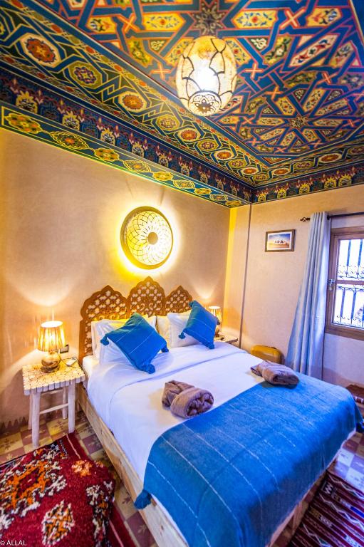 Postel nebo postele na pokoji v ubytování Riad Almonds Marrakech