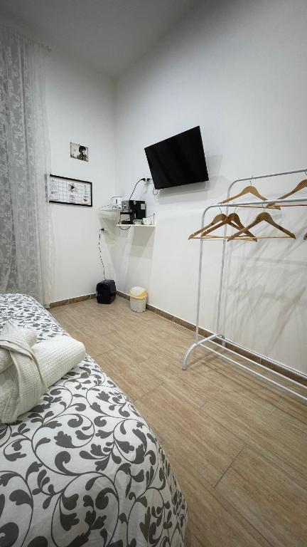 Postel nebo postele na pokoji v ubytování Scalinata Partenopea