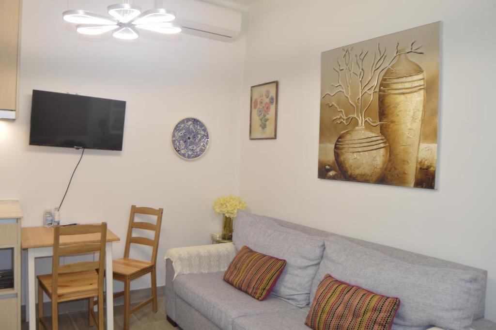 Televízia a/alebo spoločenská miestnosť v ubytovaní FLEMING Loft PARKING Tourist Córdoba