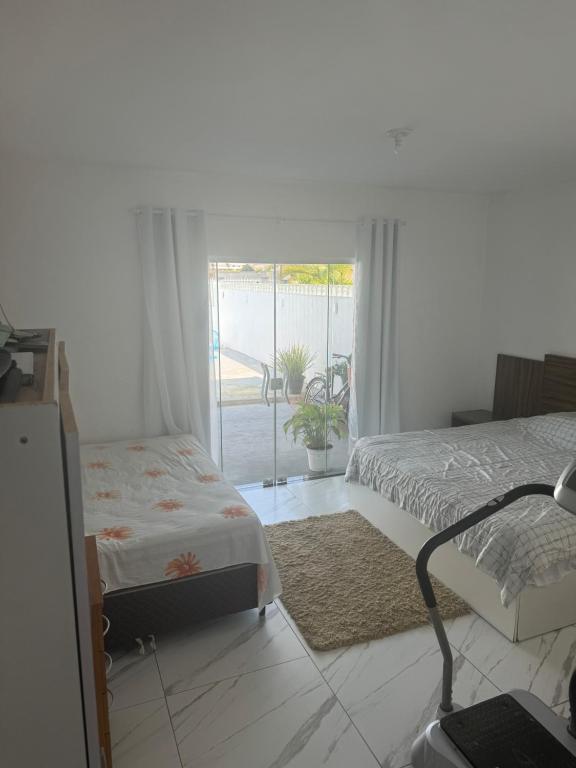 Postel nebo postele na pokoji v ubytování Casa em Guaratuba com piscina