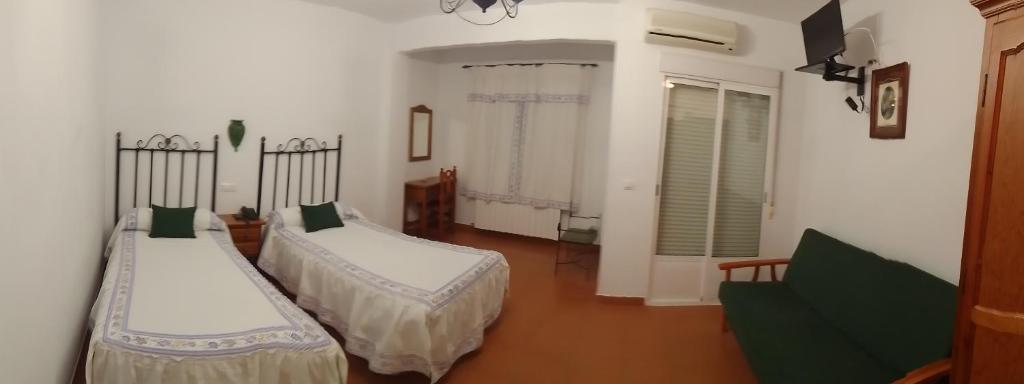Postel nebo postele na pokoji v ubytování Hotel San Julian
