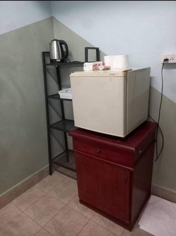 Kuchyň nebo kuchyňský kout v ubytování PLUEMCHAI Guesthouse