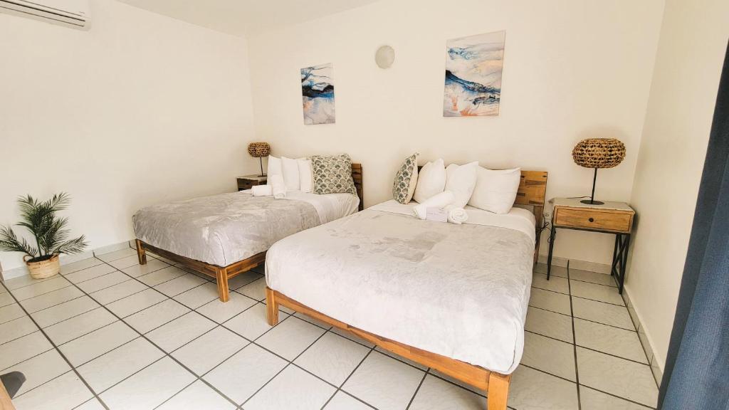 Postel nebo postele na pokoji v ubytování Nautilus by La Jamaca Hotels-Downtown La Parguera