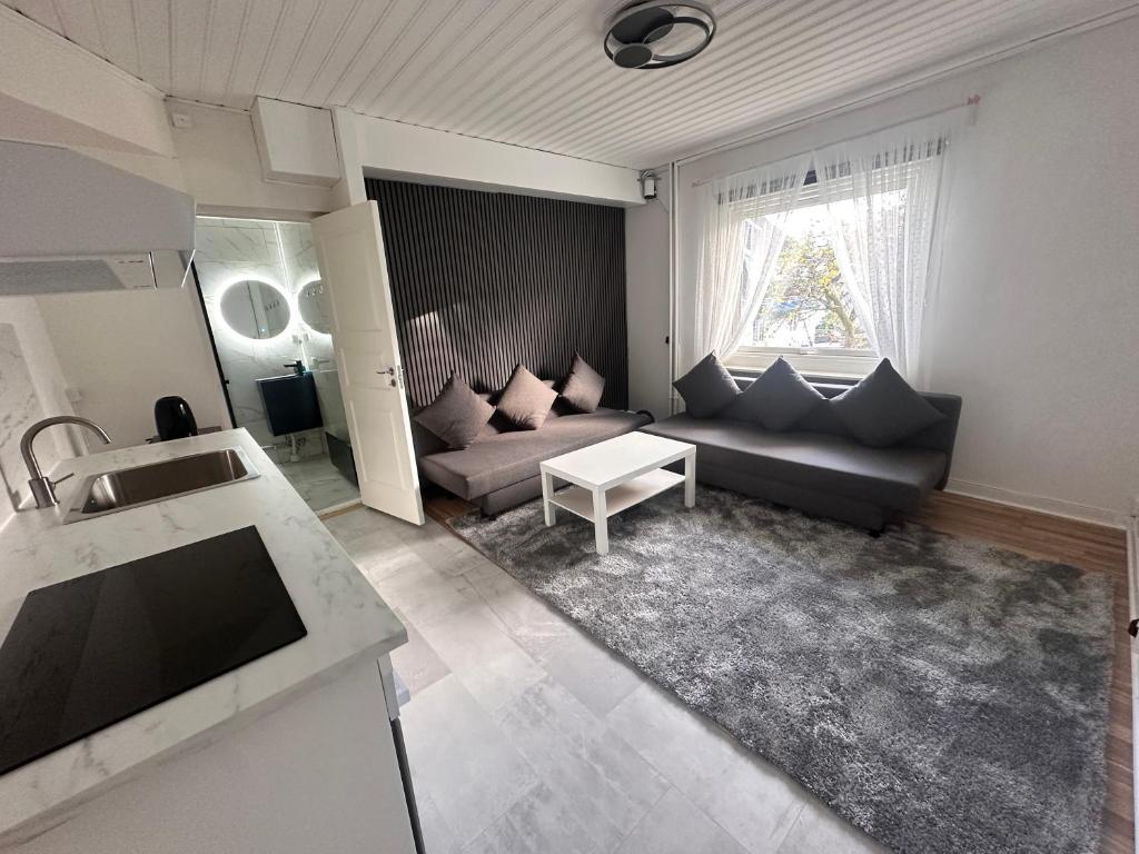 Posezení v ubytování Luxury 2 rooms residence at the heart of Borås
