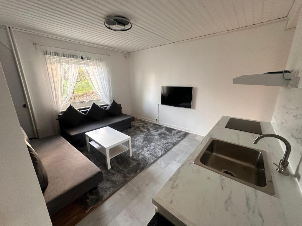 TV a/nebo společenská místnost v ubytování Luxury 2 rooms residence at the heart of Borås
