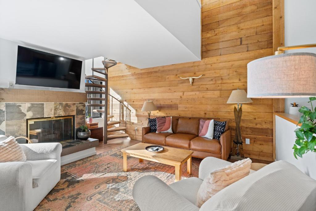 a living room with a couch and a fireplace at Plaza 1409 by Summit County Mountain Retreats in Keystone