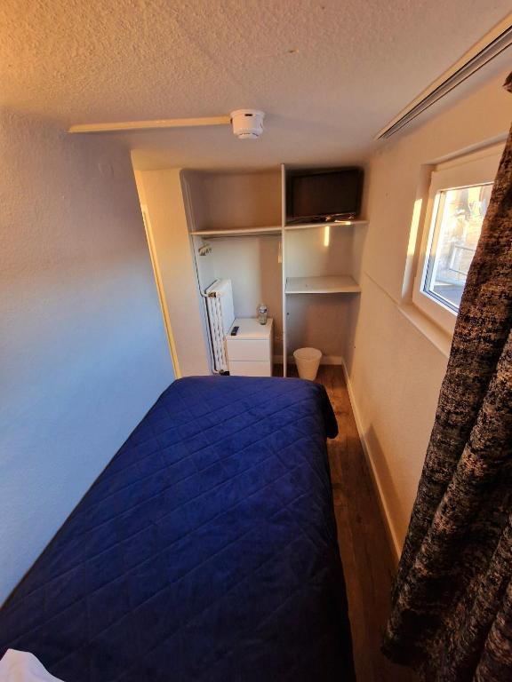 Postel nebo postele na pokoji v ubytování Hotel Bristol