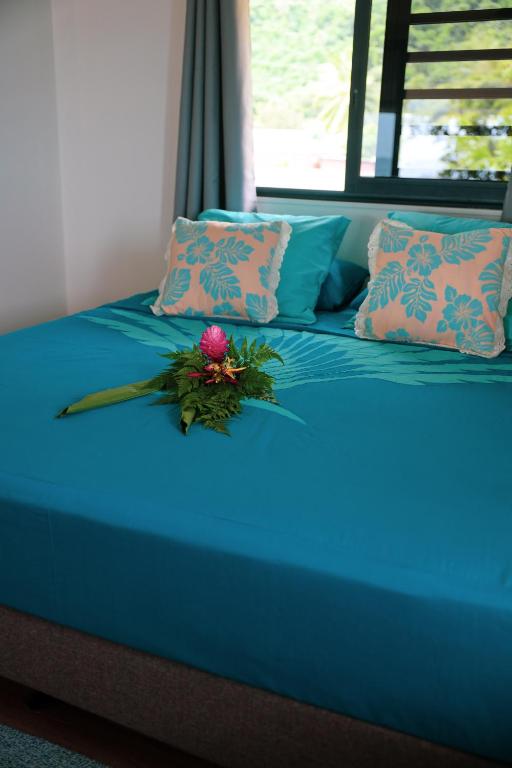 Postel nebo postele na pokoji v ubytování Teahupo'o Wave Lodge